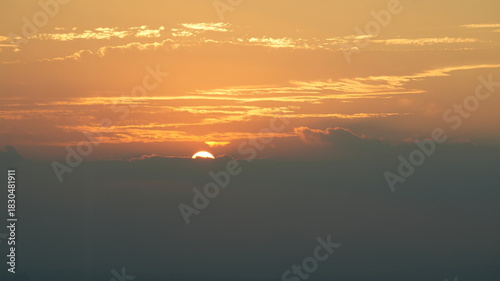 The beautiful sunset view with the colorful clouds as background in summer