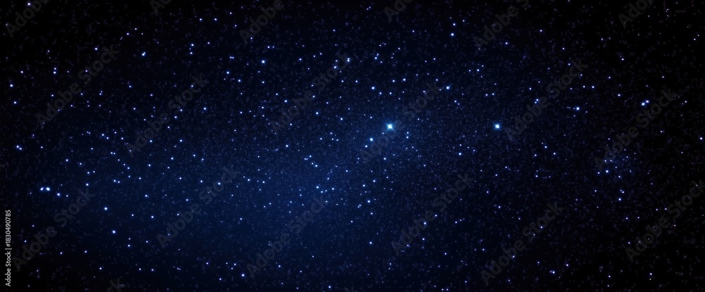Obraz premium A vast night sky filled with sparkling stars, creating a breathtaking cosmic display against a deep blue backdrop.