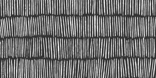 Dark gray background with irregular white vertical brush strokes in rows abstract black