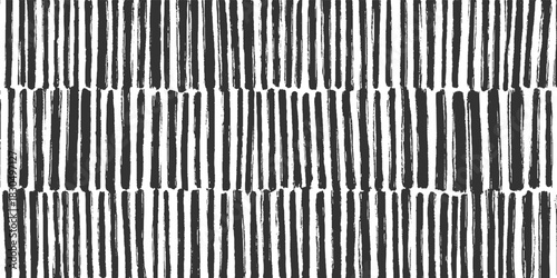 Black and white vertical brush stroke stripes pattern abstract background