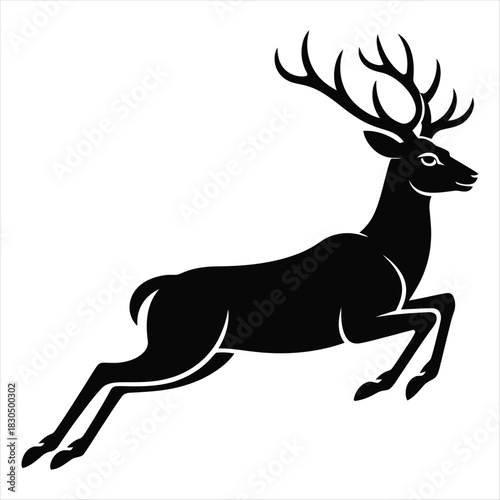 Silhouette of a leaping stag with large antlers deer