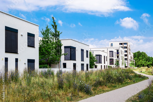 Residential Apartment Building with City Landscape. New Modern Stylish Low-rise Multifamily Building Blocks with Landscape Design. Residential Neighborhood