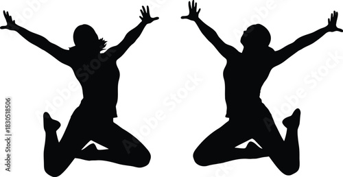Silhouette of two women jumping joyfully with arms raised