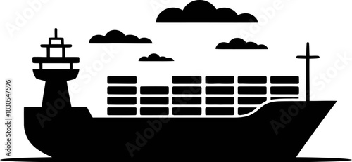 Silhouette of a cargo ship carrying containers under a cloudy sky