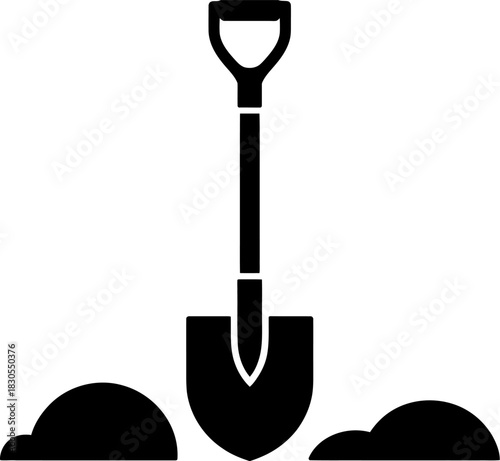 Black silhouette of a shovel digging into the earth with mounds of soil