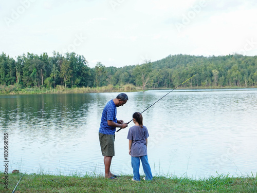 Father and Daughter Enjoying Outdoor Fishing Activity and Weekend Hobby.