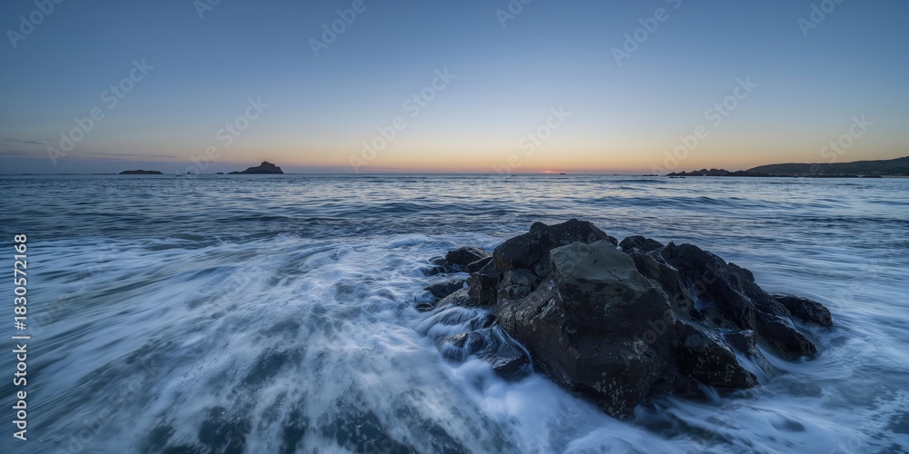 Naklejka premium Waves crashing against rocks at dawn, coastal erosion risk, Earth Day