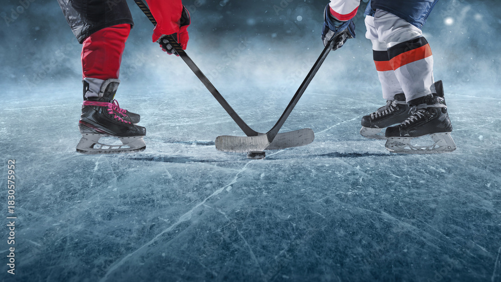 Naklejka premium Ice hockey players on the grand ice arena. A game in the ice hockey hall.