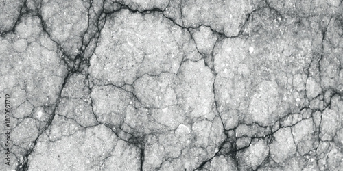 Detailed close-up texture of cracked grey asphalt pavement with visible aggregate and dark fissures creating a rough, weathered surface pattern