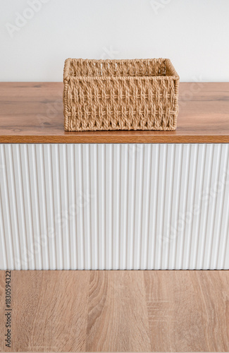 Natural Woven Basket on Modern Wooden Furniture