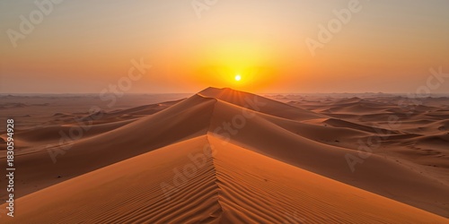 Silhouette of a person with head bowed on a deserted beach during winter, conveying solitude and seasonal change