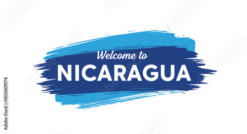 'Welcome to Nicaragua' travel message with modern white typography on an artistic blue paint brush stroke background banner.