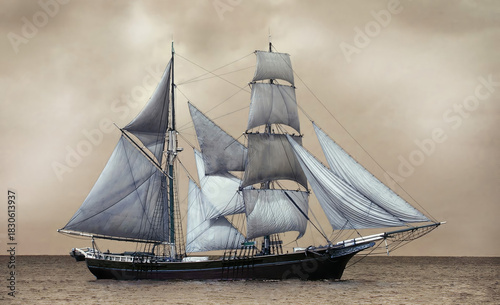 Majestic brig sailing through golden ocean waters under cloudy sky