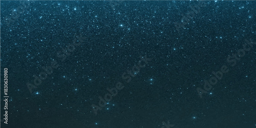 Raindrops on window reflecting dark night sky and abstract blue light with stars in motion creating a water texture pattern