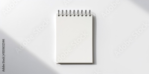 Side view of a girl using a laptop to find work projects online, emphasizing remote work setup