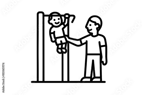 Adult male assisting a small child hanging from a pull-up bar during physical fitness training and family bonding activity