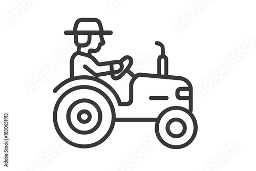 Farmer driving a large agricultural tractor used for planting and harvesting crops