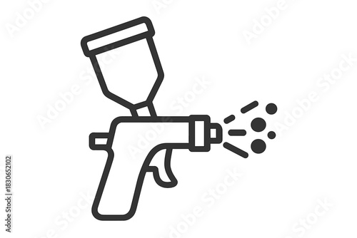 Professional paint spray gun actively spraying coating material in black and white style