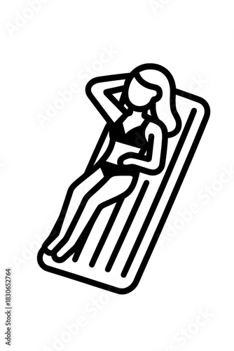 Woman relaxing on inflatable mattress while sunbathing during summer vacation