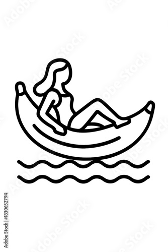 Woman enjoying summer vacation floating on a giant banana inflatable raft in the ocean water
