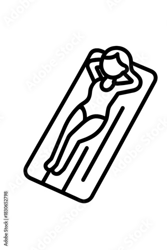 Woman relaxing and sunbathing on a floating air mattress during summer vacation