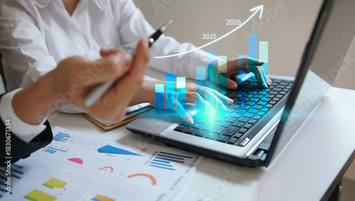 Business people using laptop to analyze performance with business analytics dashboard. strategy planning and growth opportunities, calculating company investment