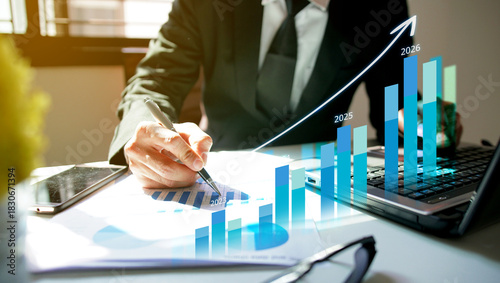 Businessman using laptop to analyze performance with business analytics dashboard. strategy planning and growth opportunities, calculating company investment