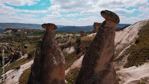 Aerial drone flying around üç güzeller fairy chimneys in cappadocia