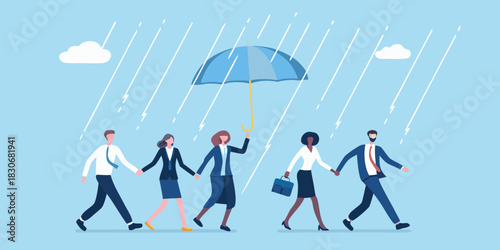 Diverse business people walking together under a single umbrella in the rain