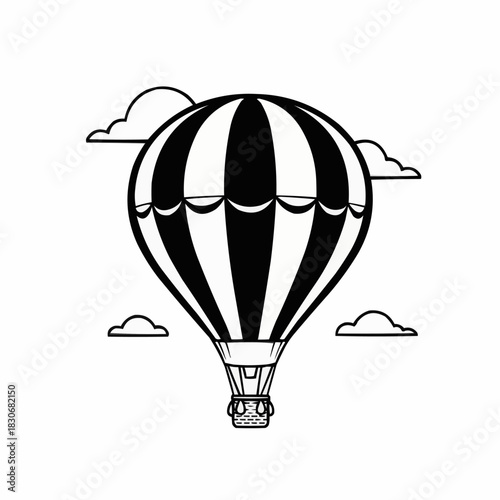 Black and white hot air balloon soaring through the sky with clouds.