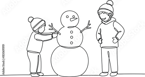 Two kids making a snowman