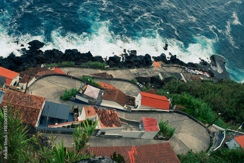 Coastal Village Nestled Above Crashing Waves