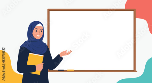 Smiling muslim female teacher or presenter wearing a hijab and holding a book stands gesturing at a blank whiteboard for education.