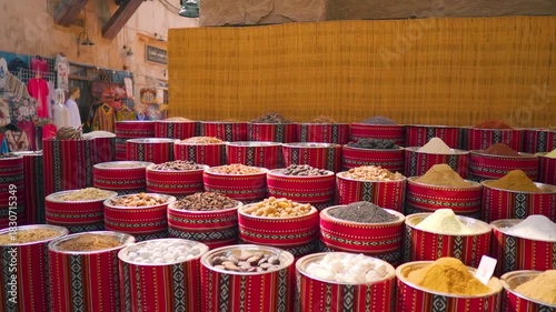 Wide angle shot of Colorful spices at a traditional market in Al Seef, Dubai, United Arab Emirates. Various spices being sold at a stall in the old marketplace at Dubai. Vibrant Spice Market. 