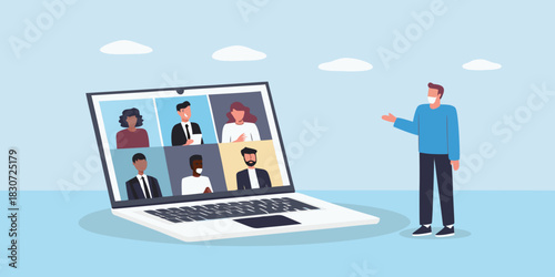 Man wearing mask participates in a video conference call with colleagues