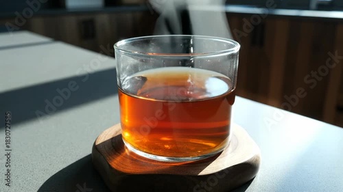 Invigorating Tea Pouring into Glass with Aesthetic Beauty and Sensual Movement Capture