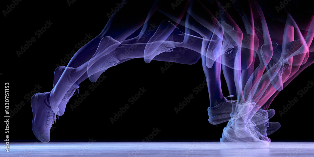 Fototapeta premium Dynamic motion-trail silhouette of running legs on dark background. Concept of biomechanics study, speed analysis, training visuals, injury-prevention tutorials, and performance-tracking content.