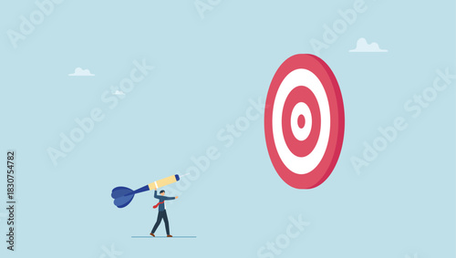 Businessman throwing huge dart, aiming to hit dartboard bullseye. Aiming for big goal, challenge to achieve target, success or accuracy, ambition or determination to reach business target.