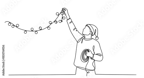Continuous line drawing of a person decorating with christmas lights and wearing a santa hat indoors