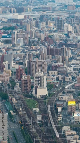 Central business district roads and railways cityscape skyline of Nagoya city, Japan. Aerial view time lapse video from day to night.