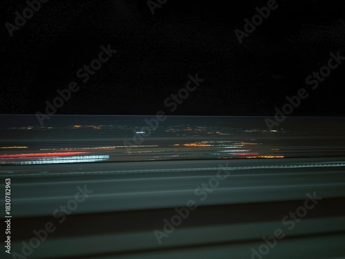 Selective focus photography. A frame in motion. Abstract background. Colorful image. Long shutter speed. Light streaks. Movement of transportation. Shooting from transportation. Blurred image.