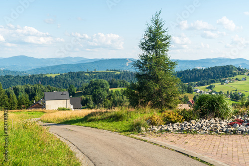 Fototapeta Naklejka Na Ścianę i Meble -  View bellow Tynioak hill summit near Koniakow village in Beskid Slaski mountains in Poland