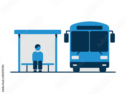 A solitary person sits at a bus stop awaiting public transportation.