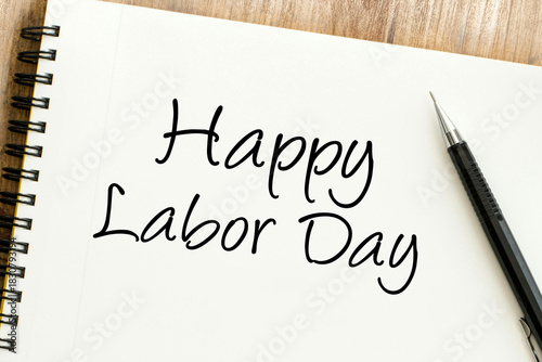 A warm Happy Labor Day message handwritten on a pristine notebook, honoring the invaluable contributions of the workforce