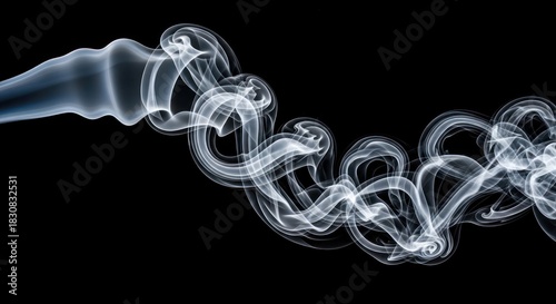 Ethereal white smoke swirling gracefully on a dark black background