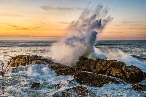 Atlantic Ocean waves crashing on rocks in Foz do Douro area of Porto, Portugal