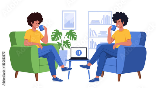 Two people with curly hair sitting in armchairs, drinking from mugs, with a laptop on a table between them in a cozy room.