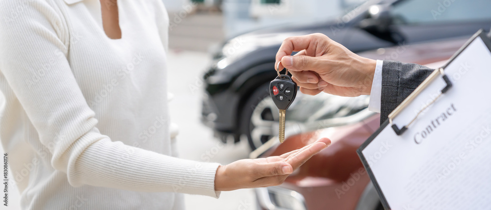 Fototapeta premium lease, rental car, sell, buy. happy pass on key for new owner. Sales, loan credit financial, rent vehicle, insurance, renting, Seller, dealer, installment, car care business