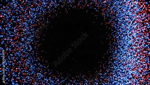 Abstract ring of red and blue particles floating in the dark space with a black background