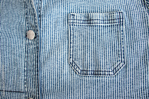 blue and white jeans striped denim garment with buttons and stitched pockets